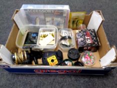 A box of fishing equipment including Daiwa reel, B-square accessory box, lures,