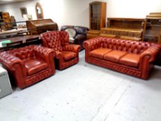 A Chesterfield three piece buttoned leather lounge suite comprising of three seater settee with