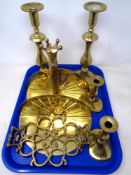 A tray of brass ware including two pairs of candlesticks plus one other,