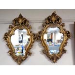 A pair of gilt framed Rococo style mirrors (Af)