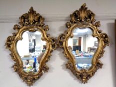 A pair of gilt framed Rococo style mirrors (Af)