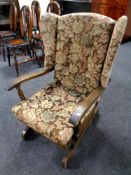 A 20th century tapestry upholstered rocking chair