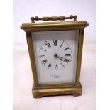 A brass cased carriage clock signed H W Bedford, 57 Regent street, London.