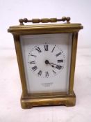 A brass cased carriage clock signed H W Bedford, 57 Regent street, London.