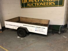 An open-top trailer measuring 246cm long by 153cm wide excluding tow hitch