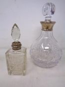 A cut glass decanter with silver collar together with similar scent bottle