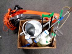 A Flymo garden vacuum together with a box containing metal watering can,