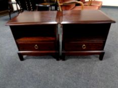 A pair of Stag Minstrel bedside chests together with a headboard