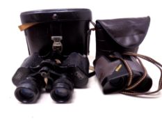 A pair of Phomar Berlin 8 x 30 field glasses together with a pair of Nikon binoculars