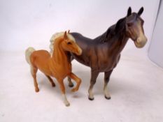 A Beswick figure of a horse together with a further foal figure