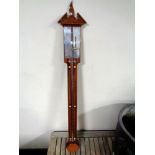 A mahogany barometer with silver dial