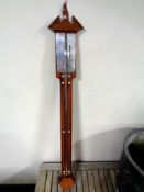 A mahogany barometer with silver dial