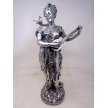 A silvered figure of a lady playing a lute