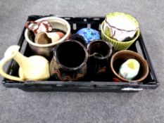 A basket of 20th century pottery including jugs, planters,