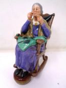 A Royal Doulton figure - A Stitch in Time HN 2352