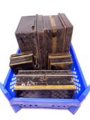 A crate of five antique metal cash tins