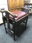 An Edwardian beech piano stool