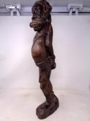 A carved hardwood African man figure