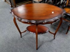 A shaped two tier occasional table