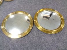 A pair of brass porthole mirrors,