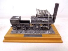 A Bachmann die cast locomotive on wooden stand