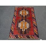 A Baluchi rug 136cm by 89cm