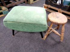 An antique stool together with a mid century sewing stool in green dralon