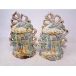 A pair of painted cast iron door stops
