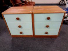 A pair of 20th century two tone three drawer bedside chests