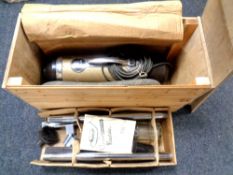 A vintage Vactrick vacuum in pine box