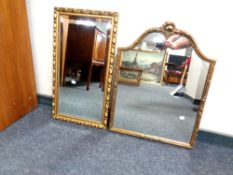 A shaped gilt framed mirror together with a further gilt framed mirror