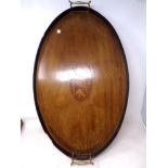 An inlaid mahogany twin handled serving tray