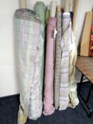 Ten rolls of upholstery fabric