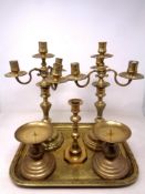 An engraved brass tray together with a pair of four-sconce candelabra,
