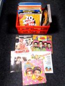 A box of vinyl LP's and box sets including The Beatles,