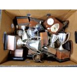 A box of plated trophies