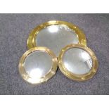 A circular brass porthole mirror,