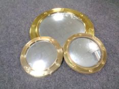 A circular brass porthole mirror,