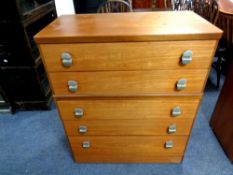 A 20th century teak five drawer chest