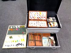 An aluminium storage chest fitted with two drawers containing fly fishing items,
