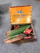 A vintage Blue Bird Luxury Assortment tin containing vintage Meccano