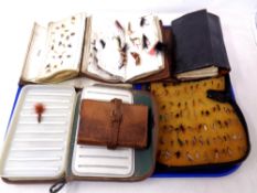 Six fly wallets and cases containing fishing flies