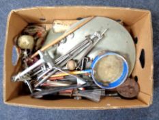 A box containing vintage musical instruments including tambourine,