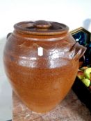 A stoneware salt glazed lidded jar