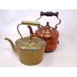 A copper kettle and brass kettle