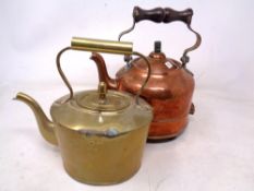 A copper kettle and brass kettle