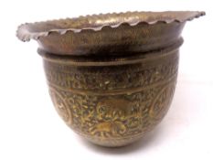 A 19th century Indian embossed brass planter