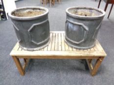 A pair of cylindrical garden planters together with teak garden low table and brass fire front
