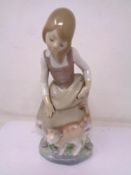 A Lladro figure - Girl with cat