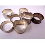 Seven various hallmarked silver napkin rings